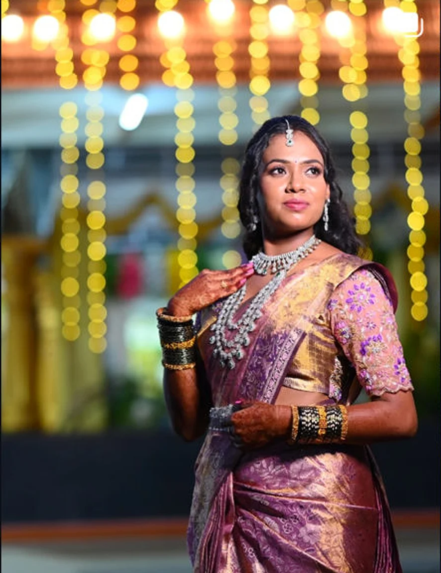 A bride in purple and gold silk with a diamond set